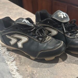 Black Athletic Cleats with White Accents